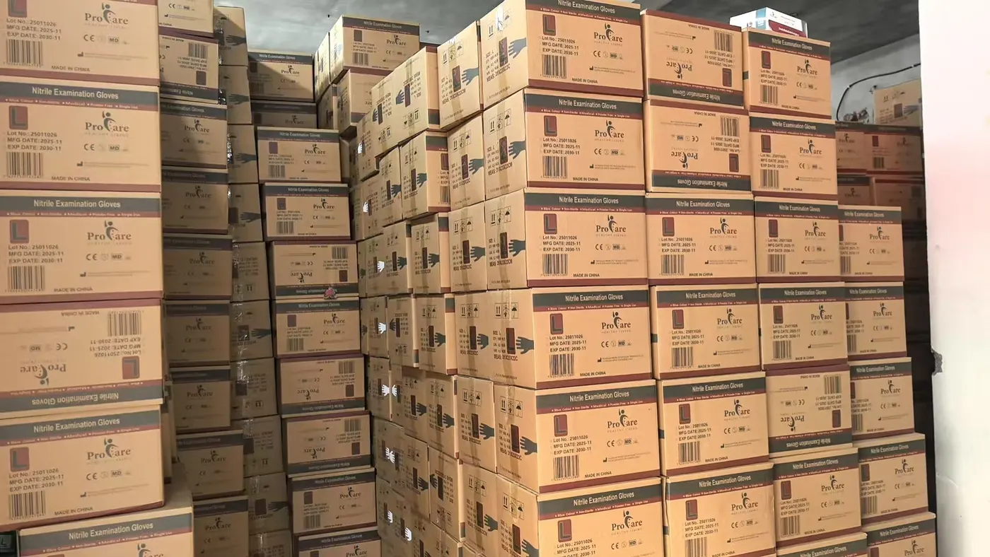 Private label nitrile examination glove cartons with lot and barcode information